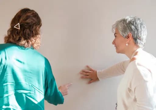 Sandra in conversation with a client, discussing the feel of the room together