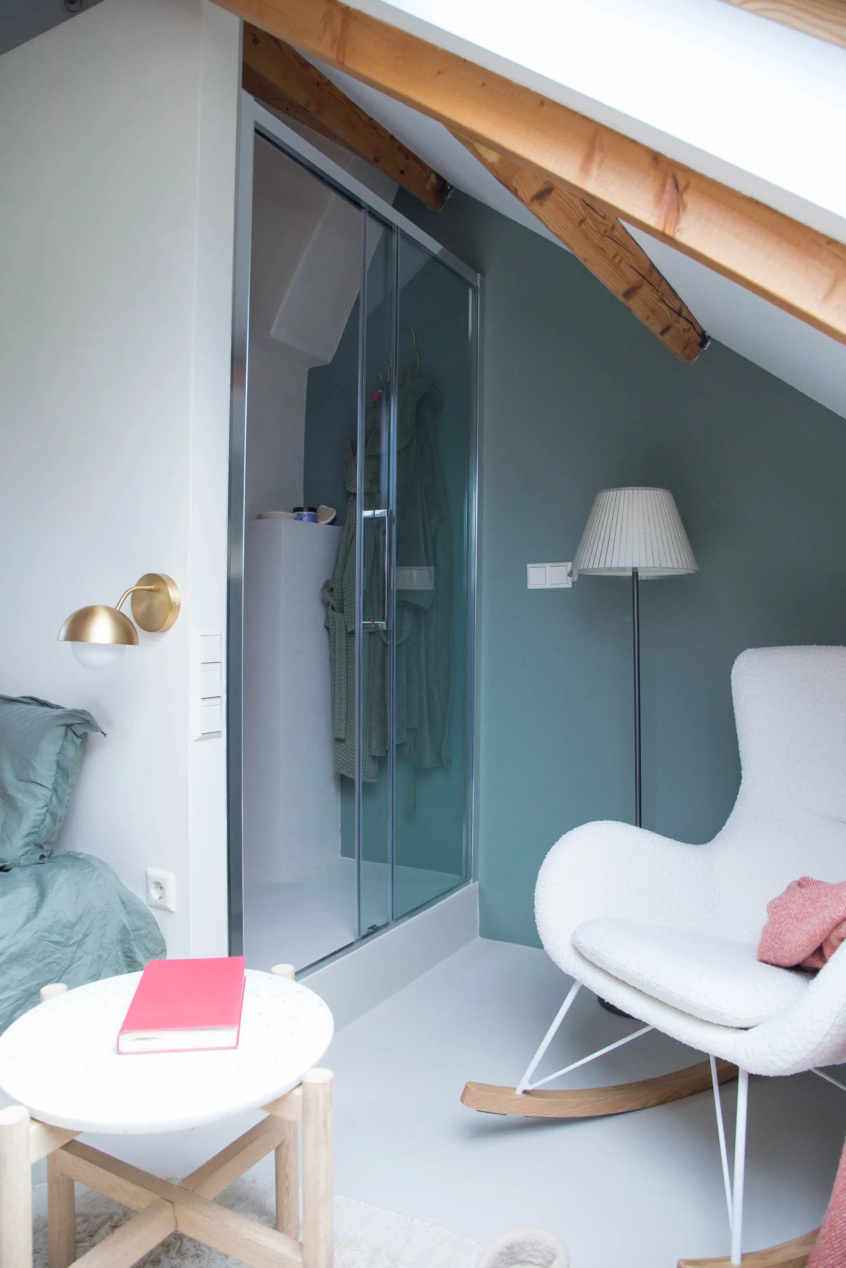 Tasteful Attic transformation shower and reading chair