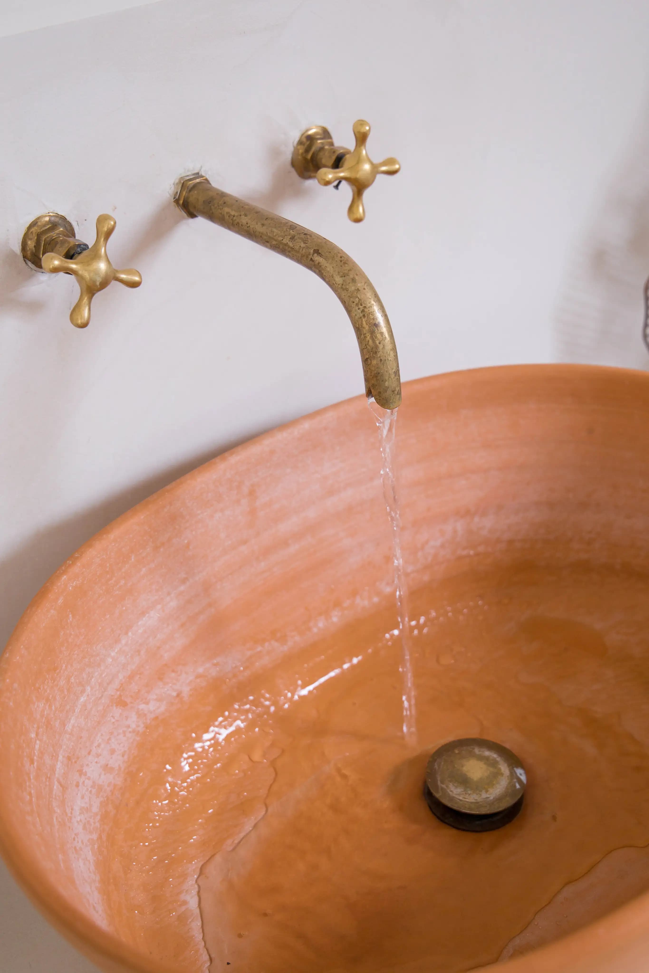 Tasteful Attic transformation terracotta sink detail
