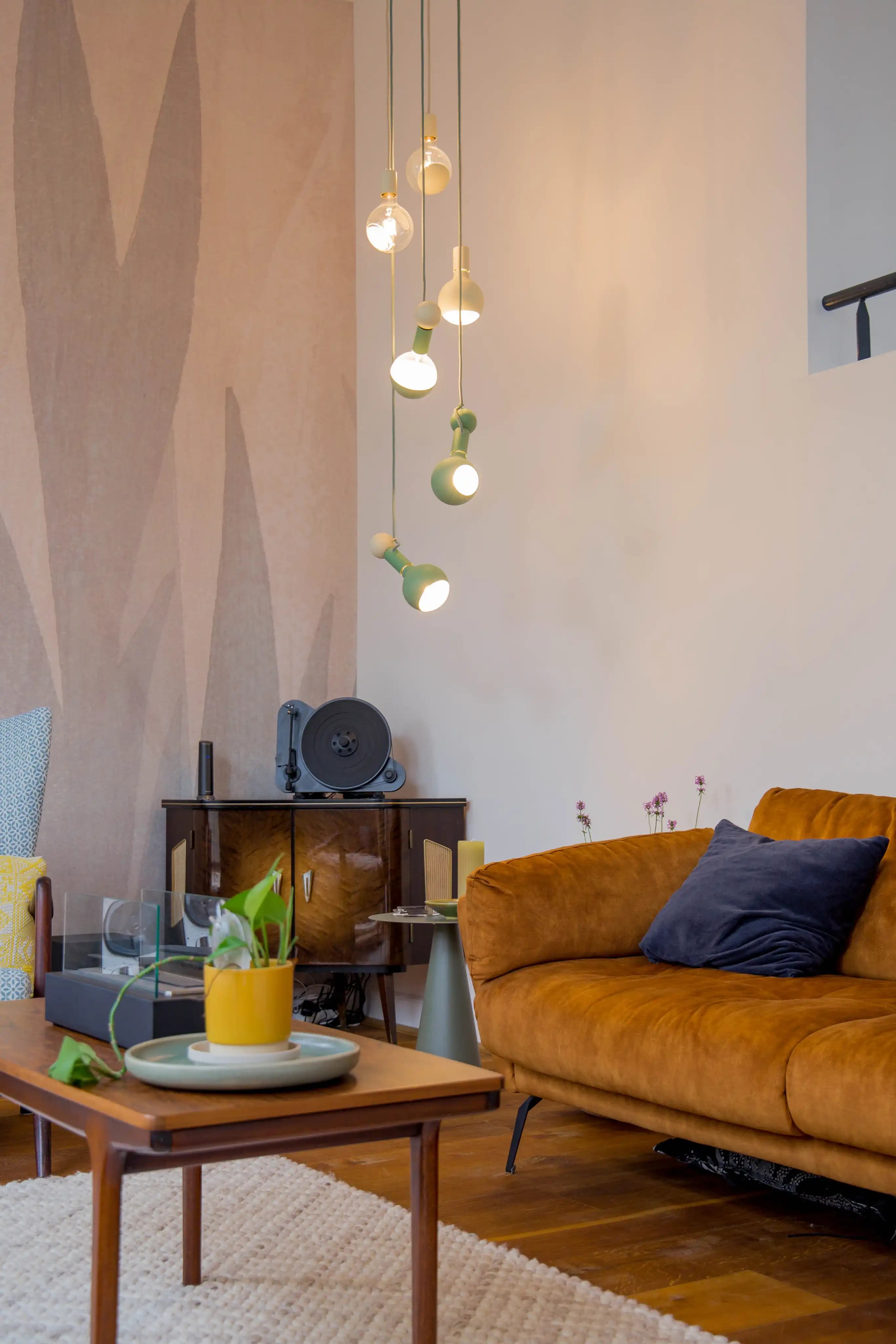 The Gentle Nest sofa corner with pendant lights